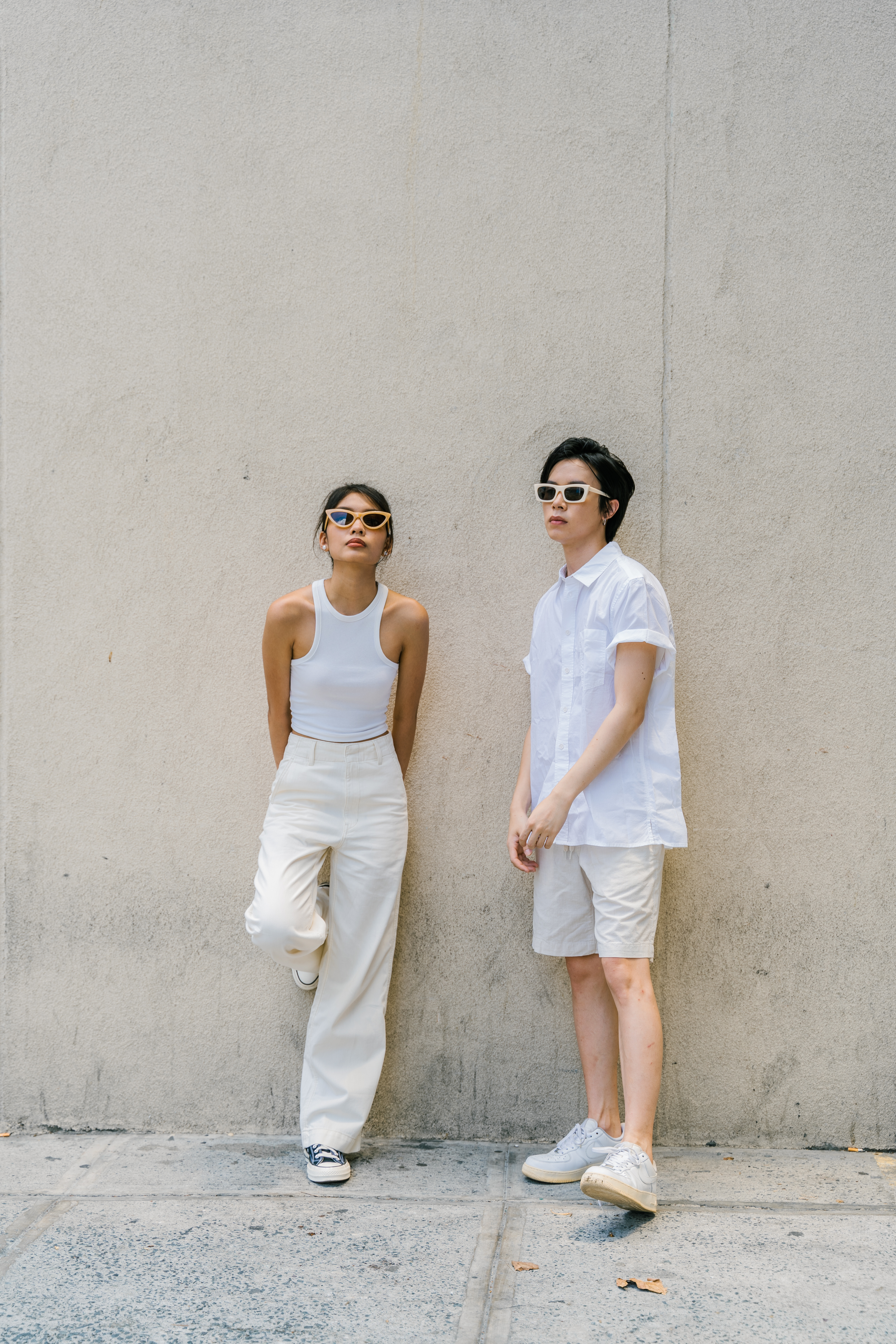 Man and Woman in White Casual Clothes